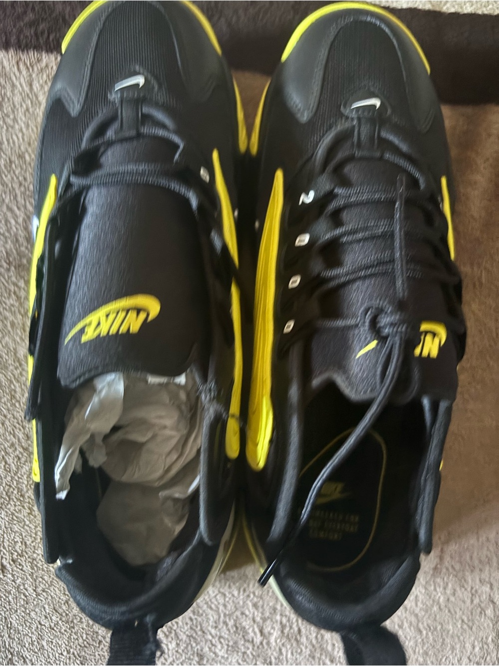 Yellow and black nike zooms